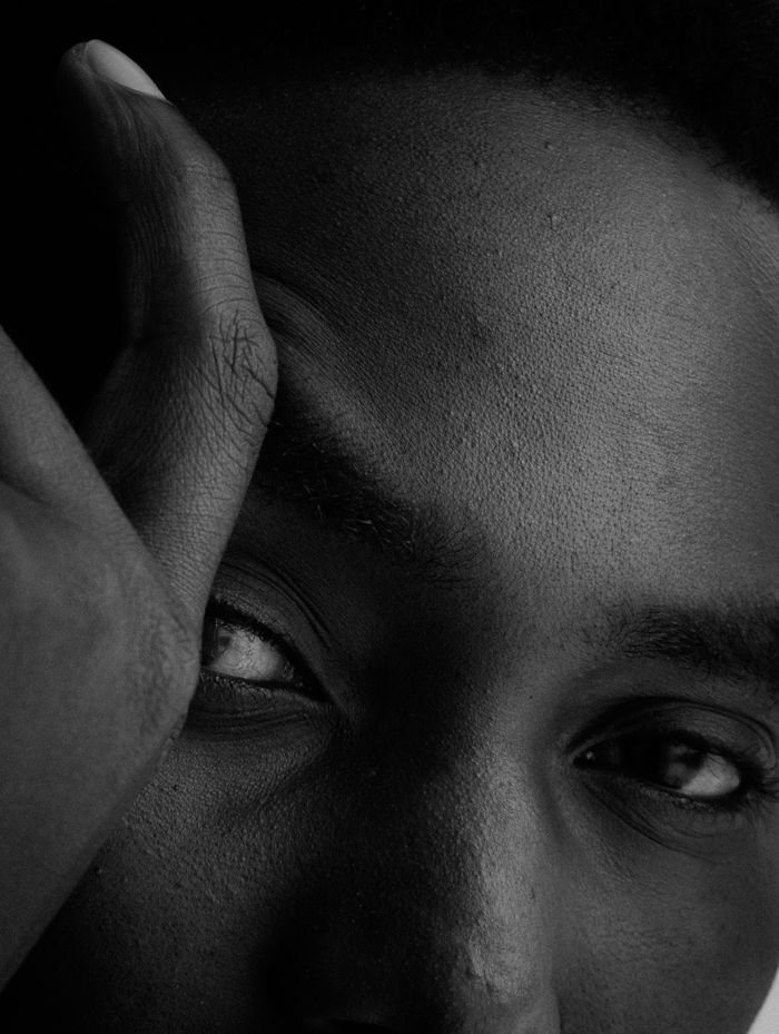 Artarene Intimate black and white close-up of a person showing emotion.